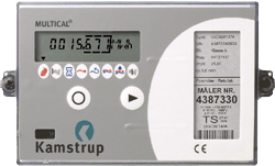 Billedet viser varmemåler Multical 66, en grå kasse med et display.